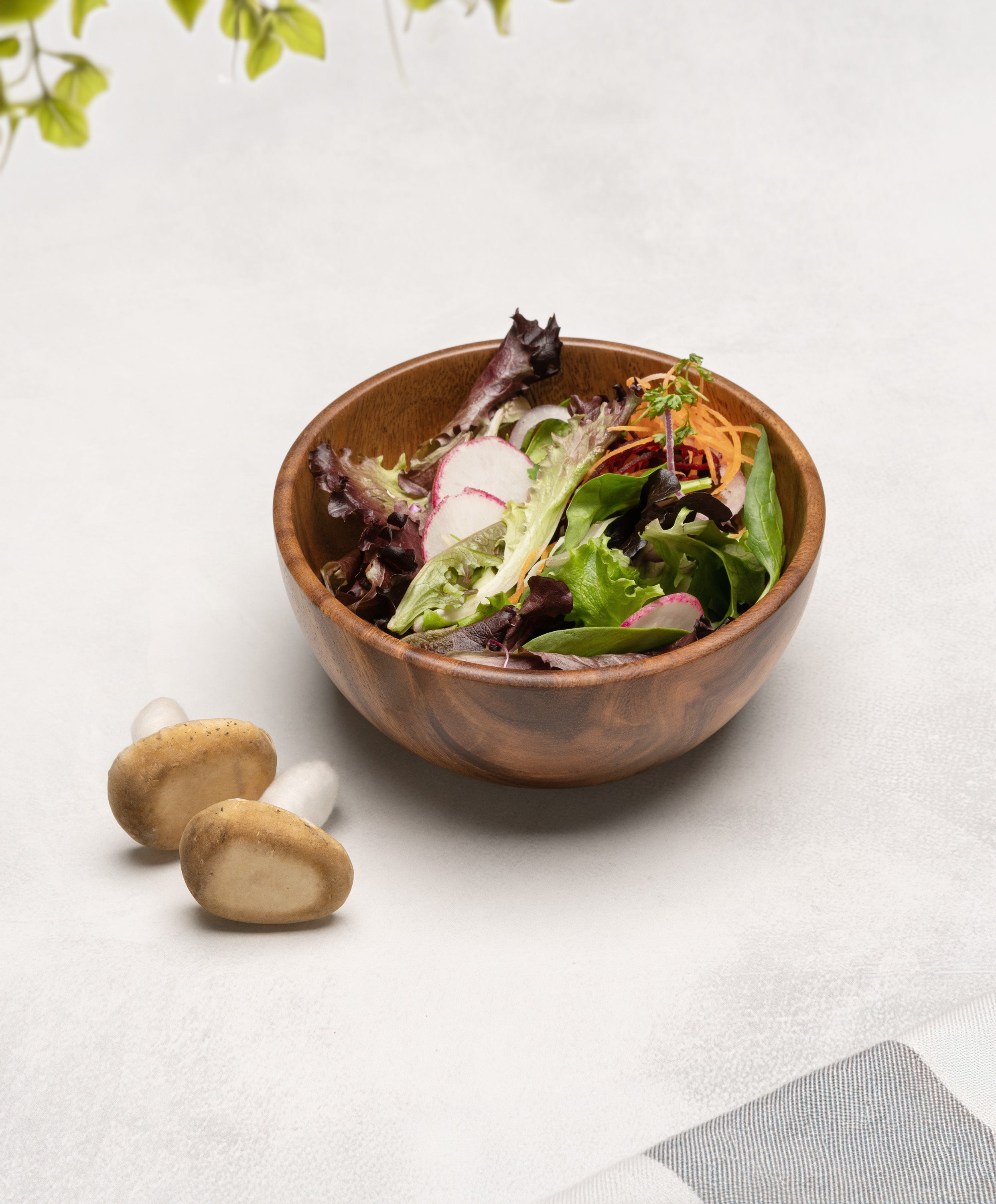 Foree wooden bowl 6.25 x 2.5 in with fresh salad inside and mushrooms on the side, showcasing natural Acacia woodgrain