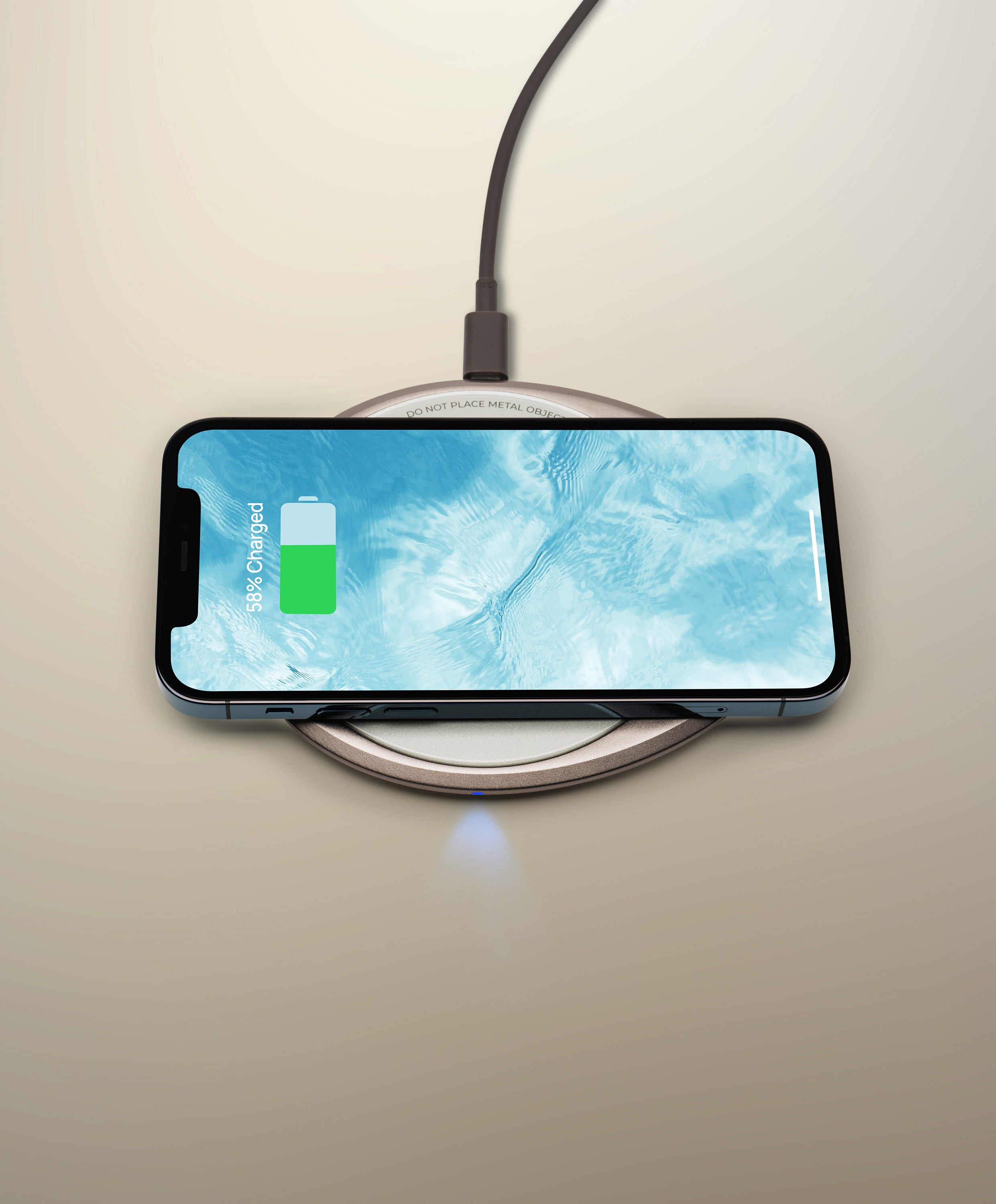 OHOM Pad 3 Cosmic Silver charging iPhone