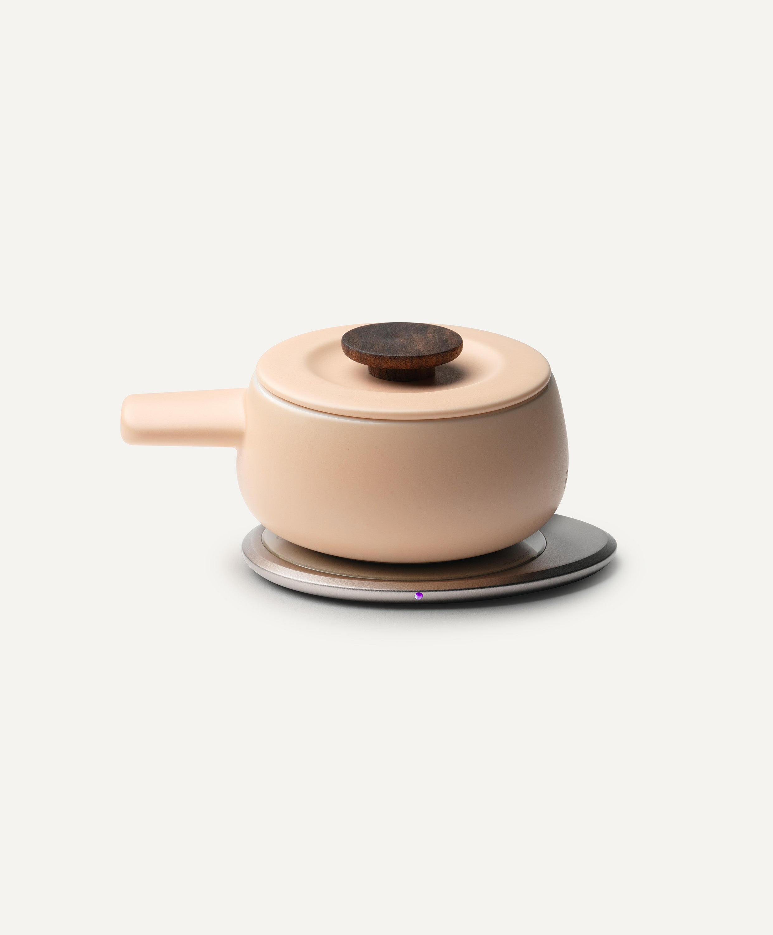 Fondi Self-Heating Ceramic Fondue 7.6 fl oz / 225 mL in Rosy Apricot on Ohom Charging Pad 3