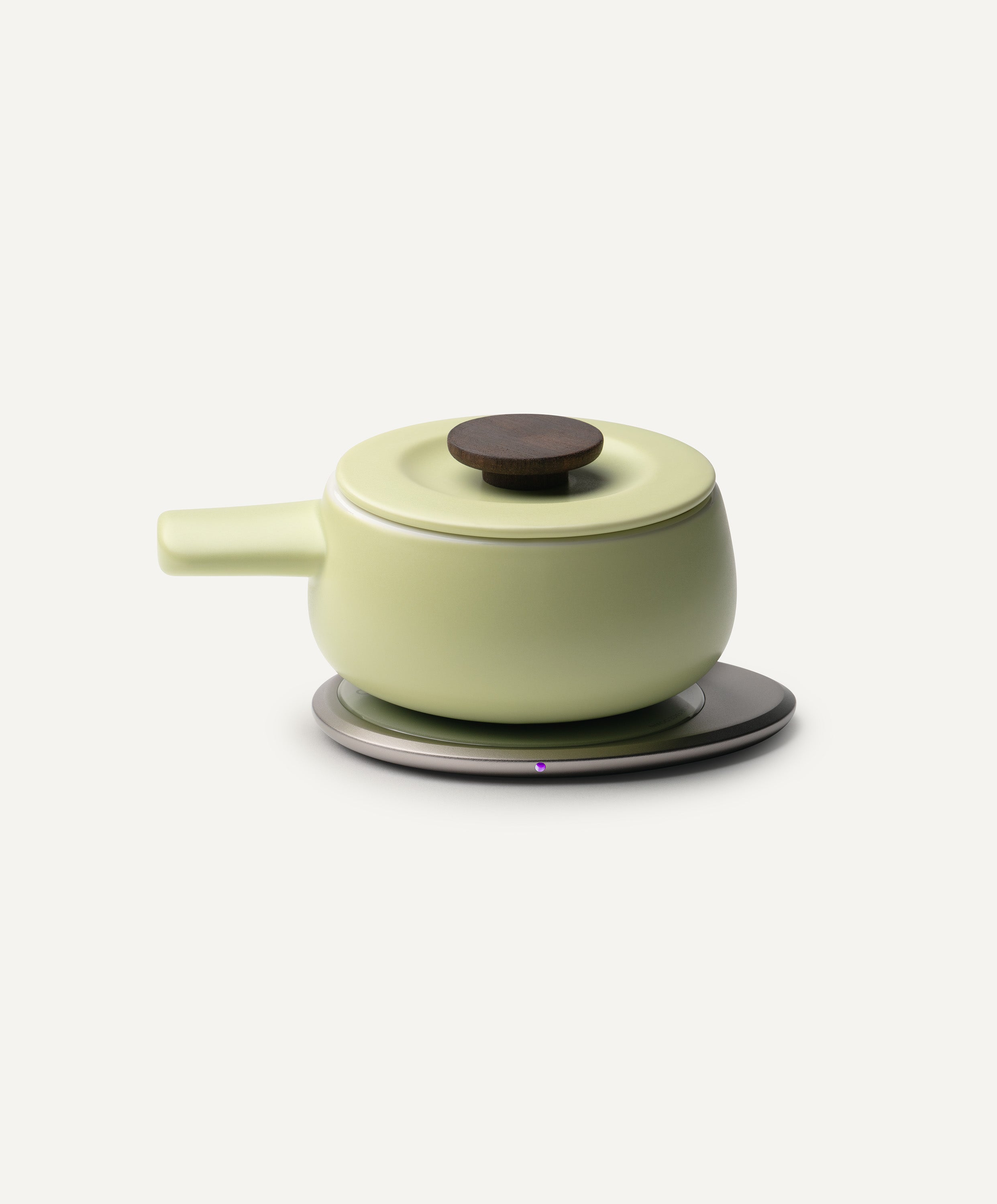 Fondi Self-Heating Ceramic Fondue 7.6 fl oz / 225 mL in Verde Green on Ohom Charging Pad 3