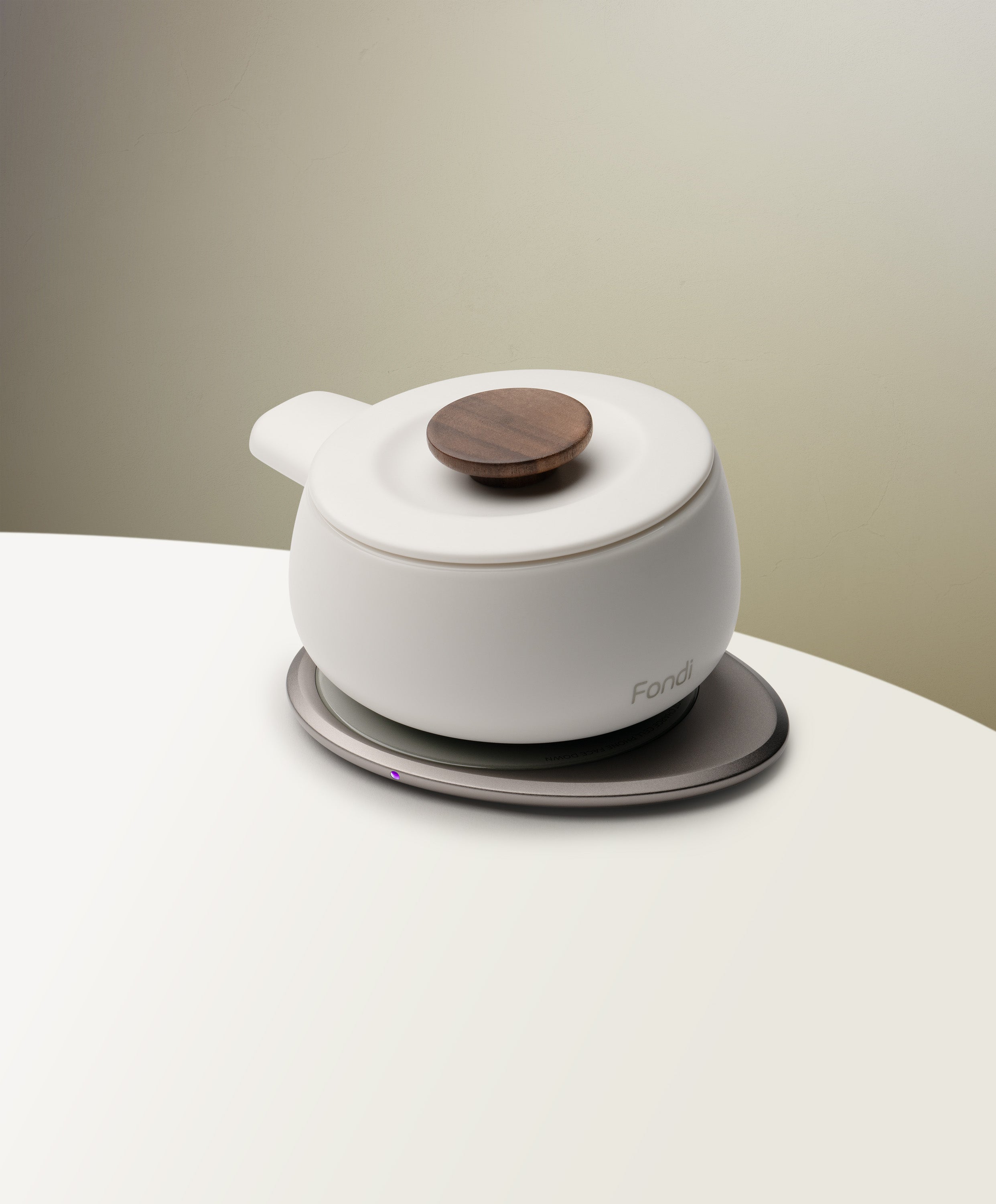 Side view of Fondi Self-heating Fondue Set 7.6 fl oz in Jasmine White warming on the OHOM Pad