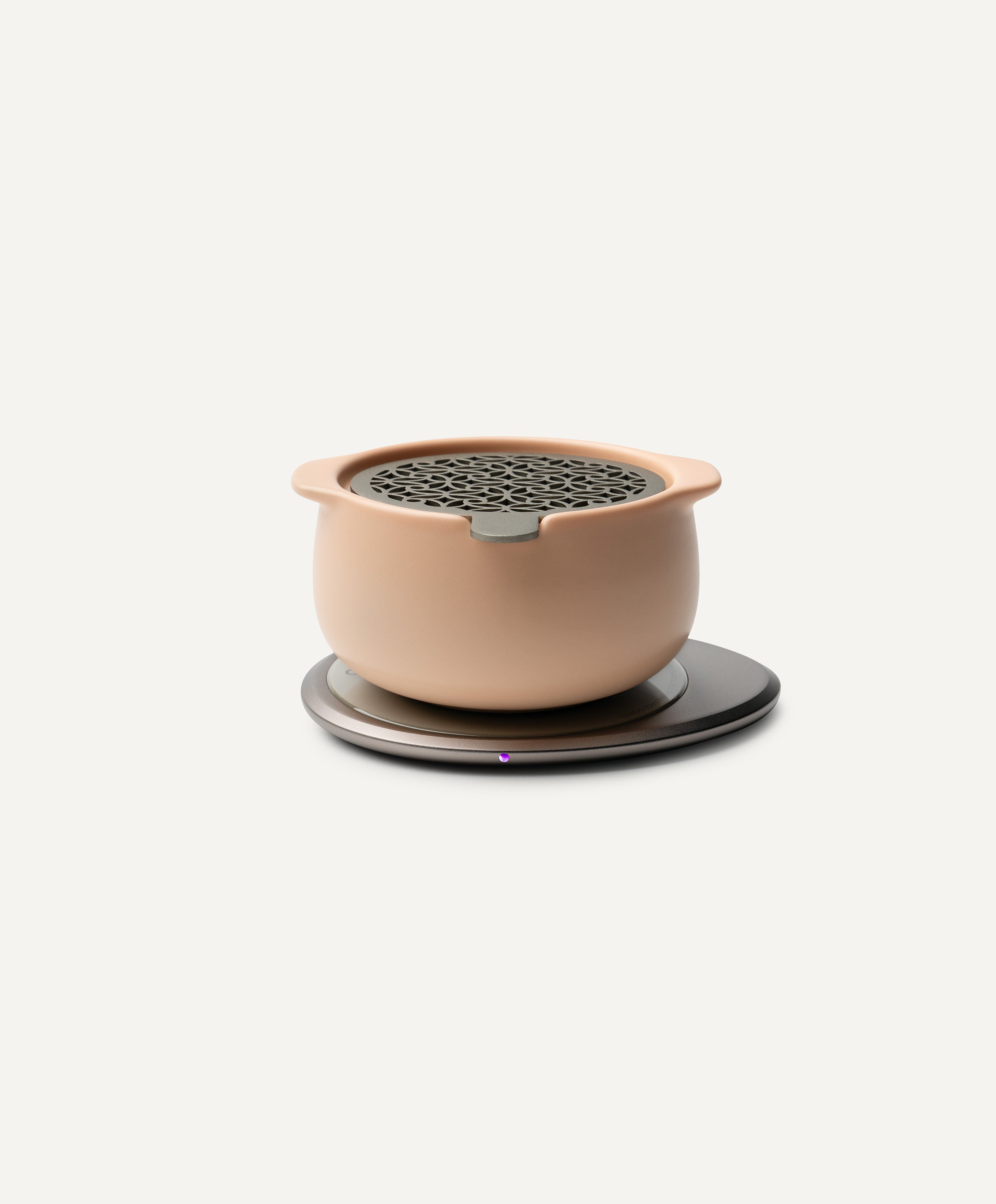 Jun Self-Heating Ceramic Diffuser 5 fl oz / 150 mL in Rosy Apricot with lid on Ohom Pad 3