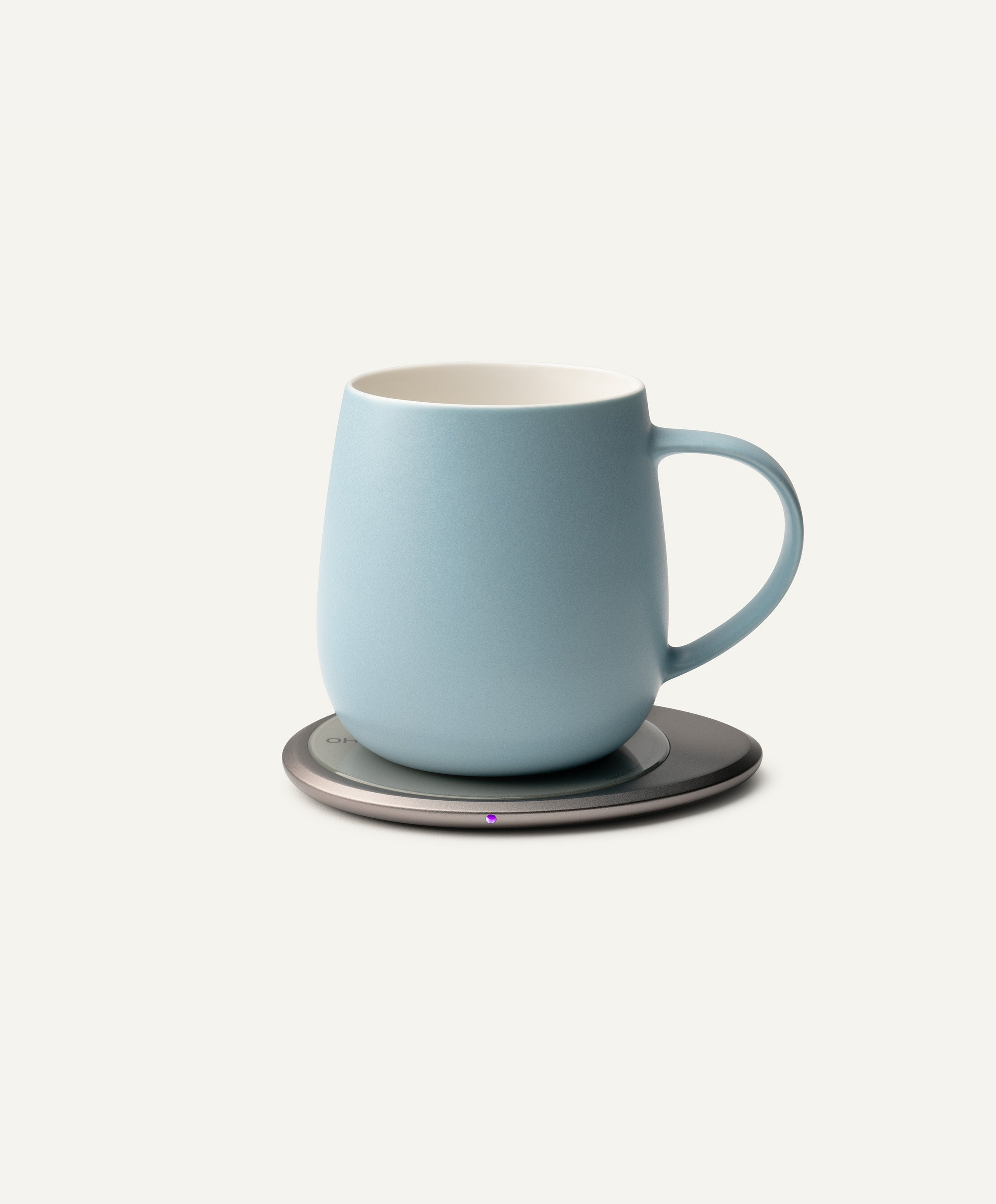 Ui 3 Self-Heating Ceramic Mug 12 fl oz / 355 mL in Moonmist Blue on Ohom Charging Pad 3