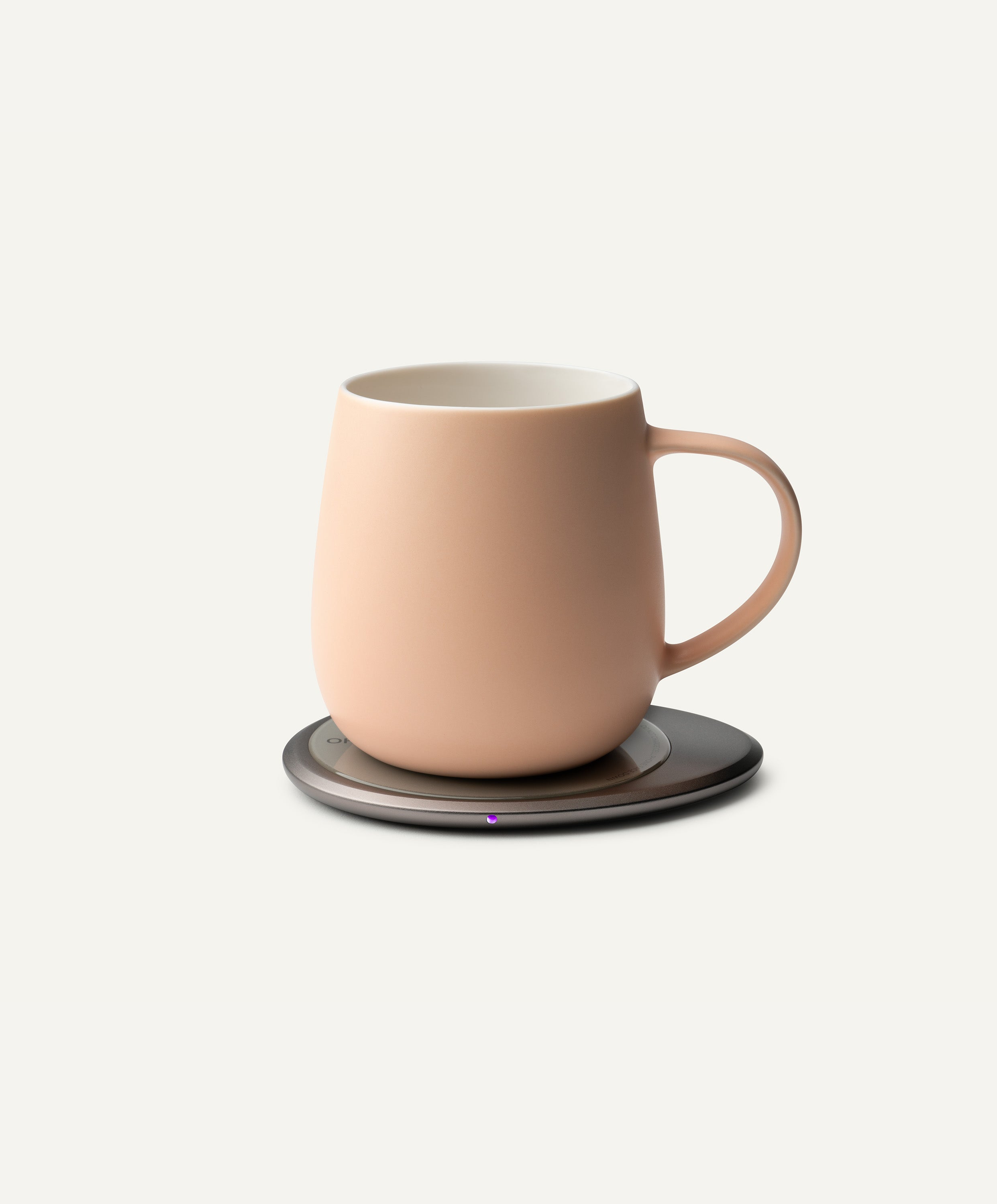 Ui 3 Self-Heating Ceramic Mug 12 fl oz / 355 mL in Rosy Apricot on Ohom Charging Pad 3