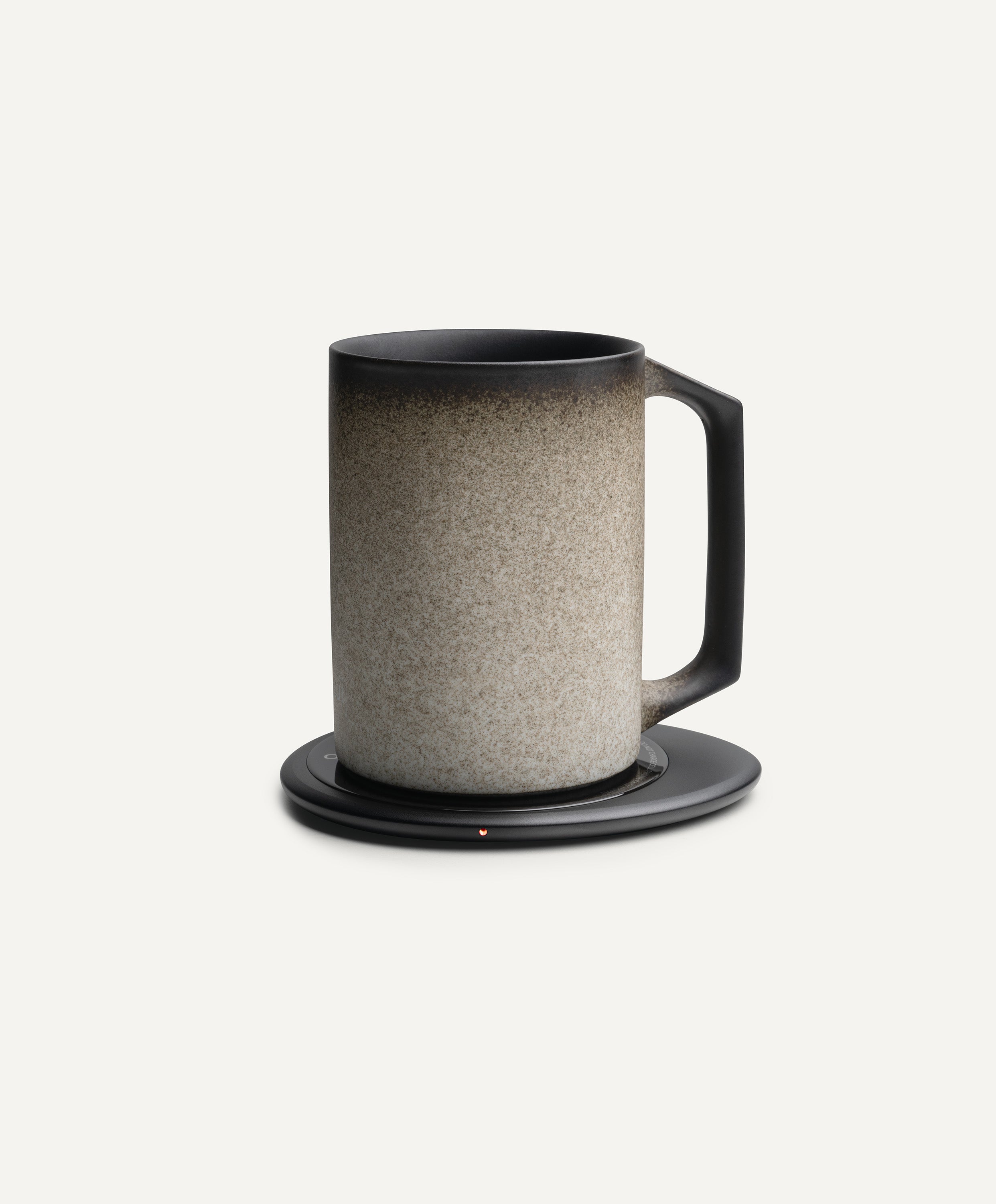 Ui Artist Collection Self-Heating Ceramic Mug 12 fl oz / 355 mL in Iron Noir on Ohom Charging Pad 3