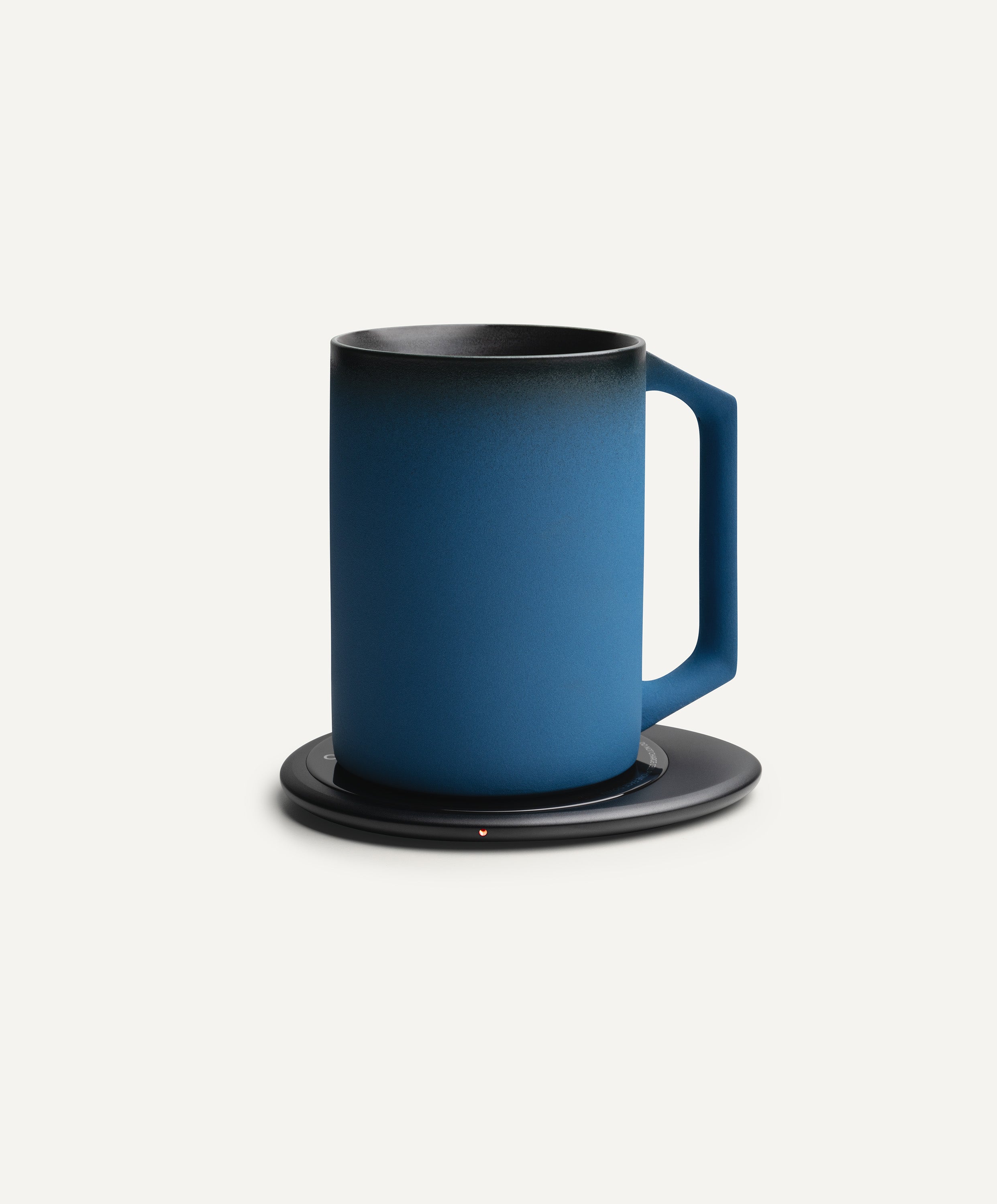 Ui Artist Collection Self-Heating Ceramic Mug 12 fl oz / 355 mL in Midnight Abyss on Ohom Charging Pad 3