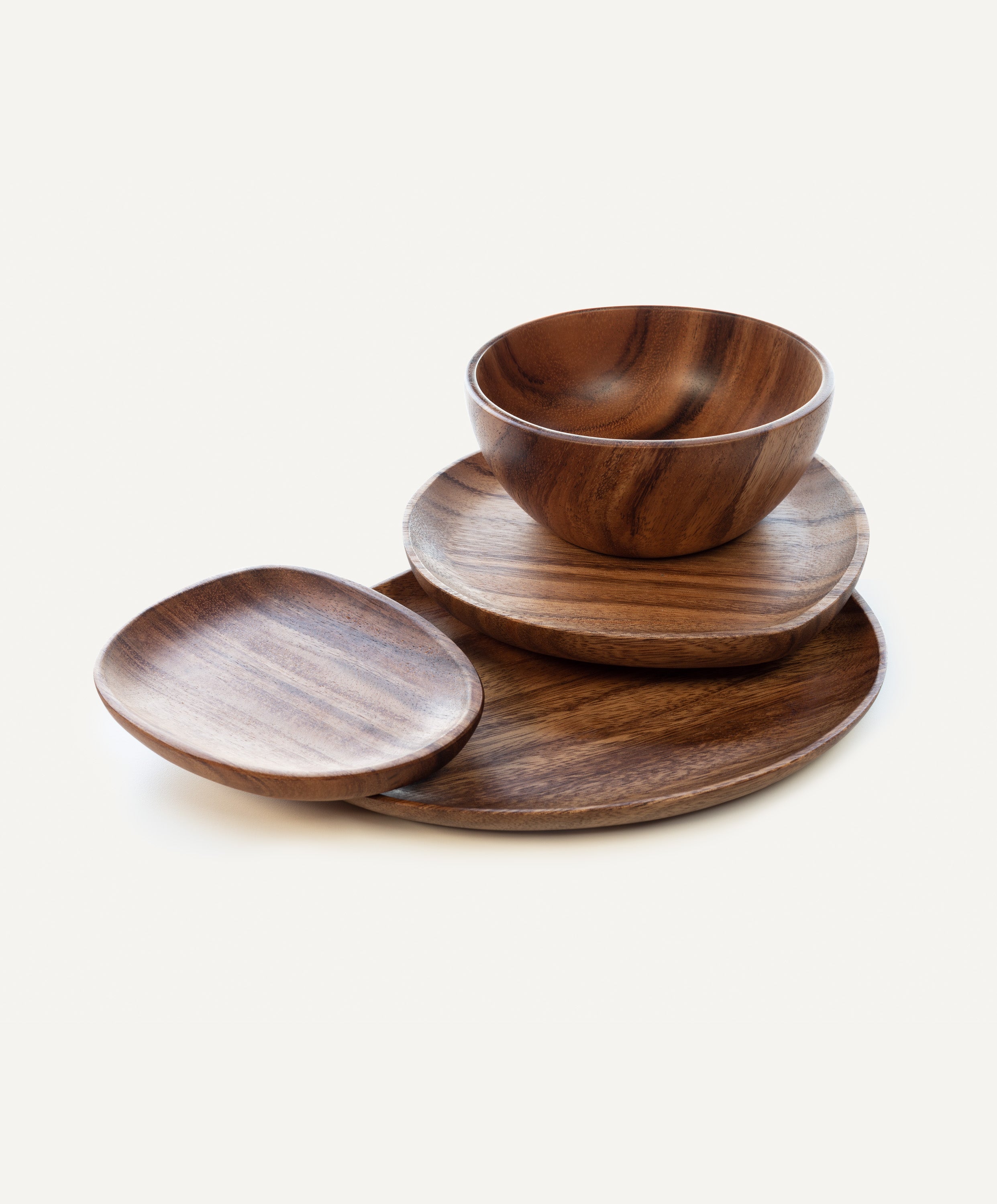 Foree wooden dinnerware set handcrafted from solid Acacia wood with large, medium, and small plates and salad bowl