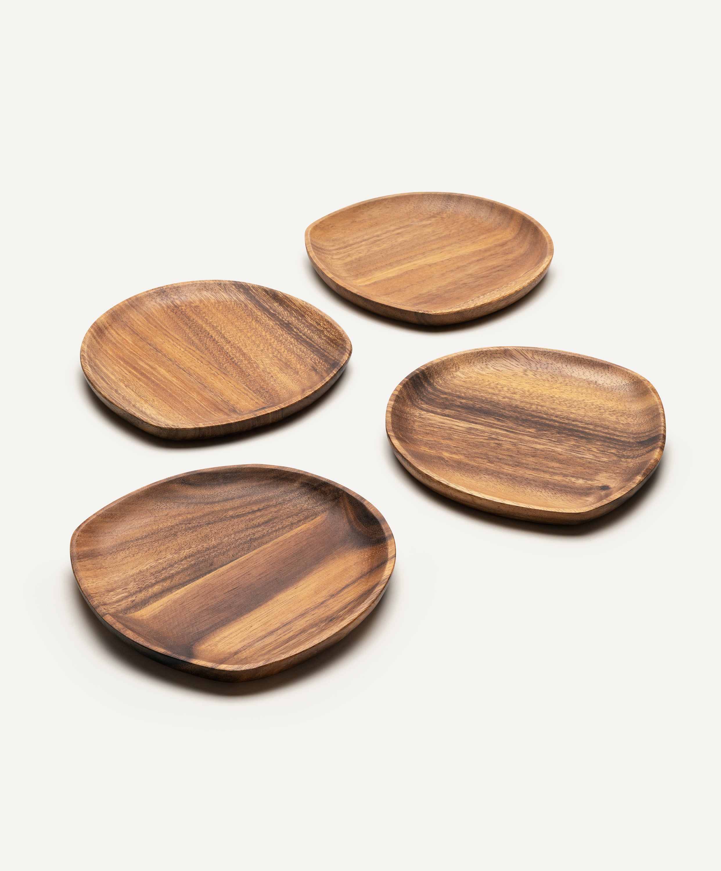 Set of four Foree medium wooden plates made from solid Acacia wood, size 7.9 x 7.7 x 0.75 in, displayed side by side showing natural woodgrain texture