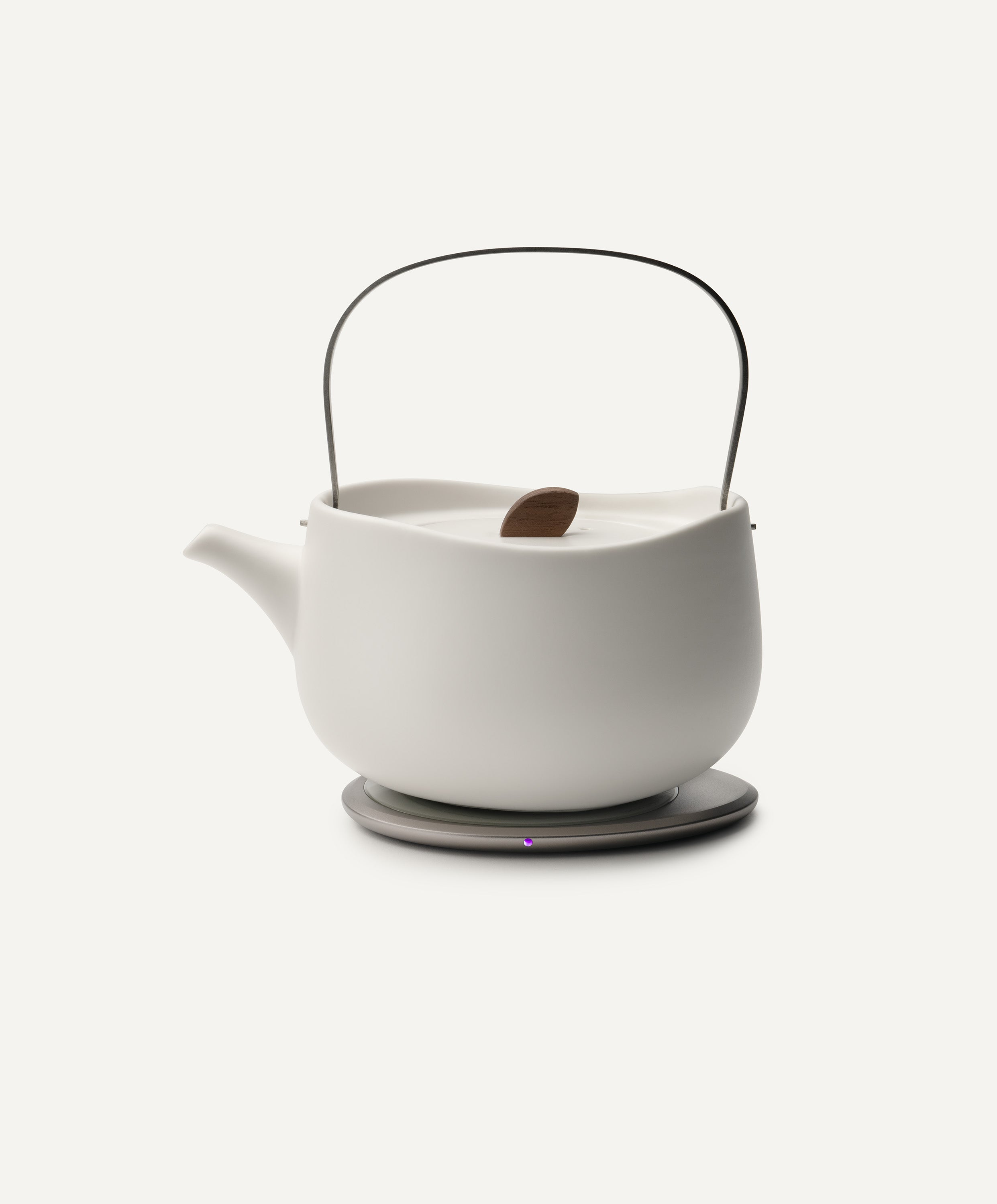 Leiph Self-Heating Ceramic Teapot Set 20 fl oz / 600 mL in Jasmine White on Ohom Charging Pad 3