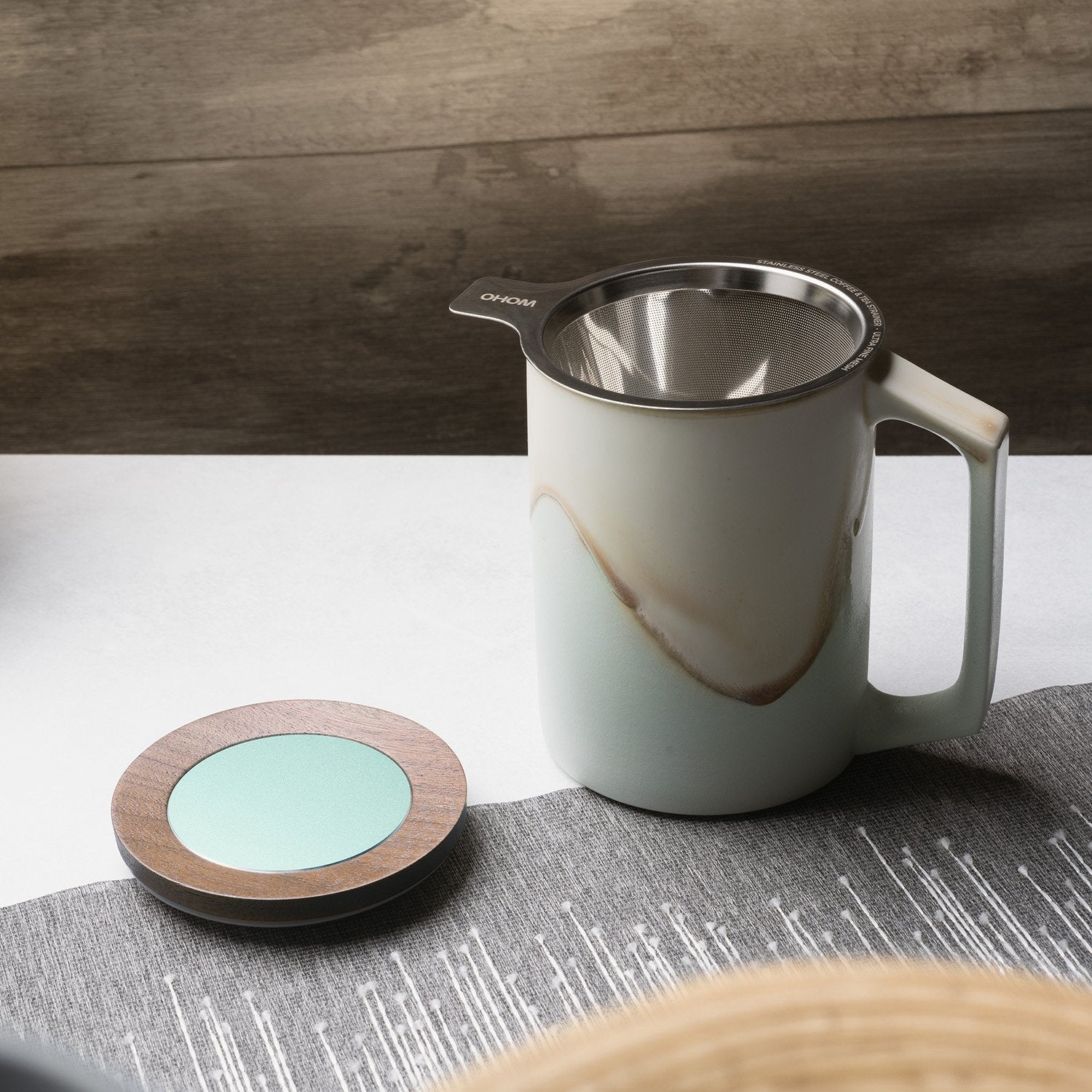 Mint colored mug with design and strainer and lid