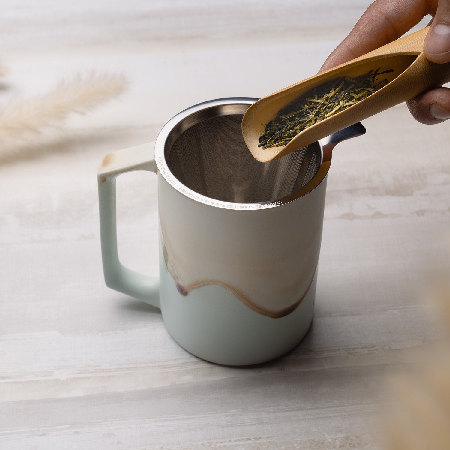 Large tea strainer with mint colored mug