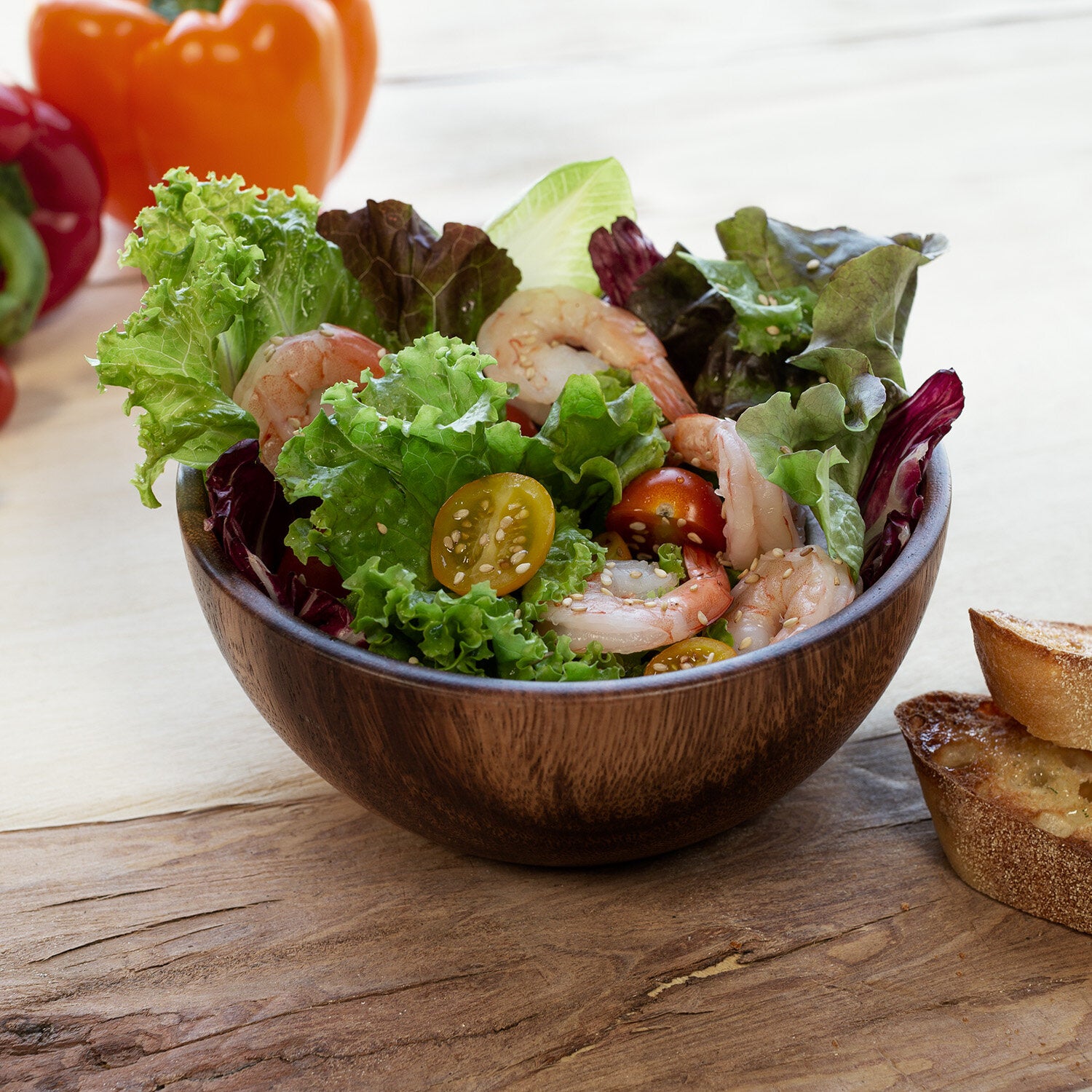 Shrimp salad in wooden bowl