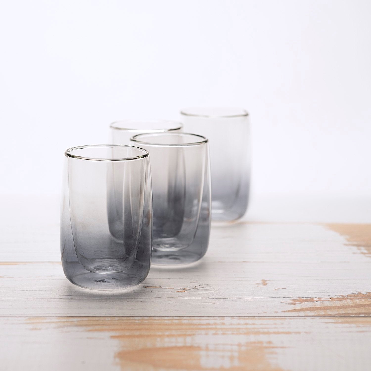 Four glass cups on a table