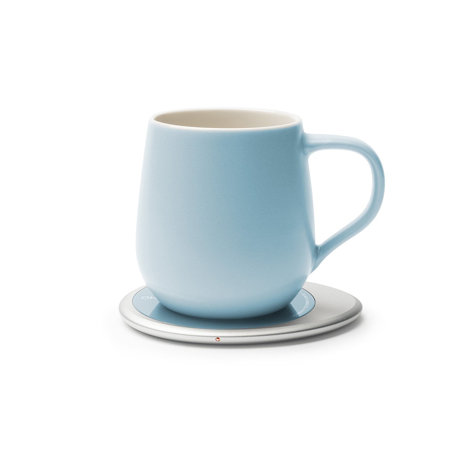 Light blue mug on heating pad
