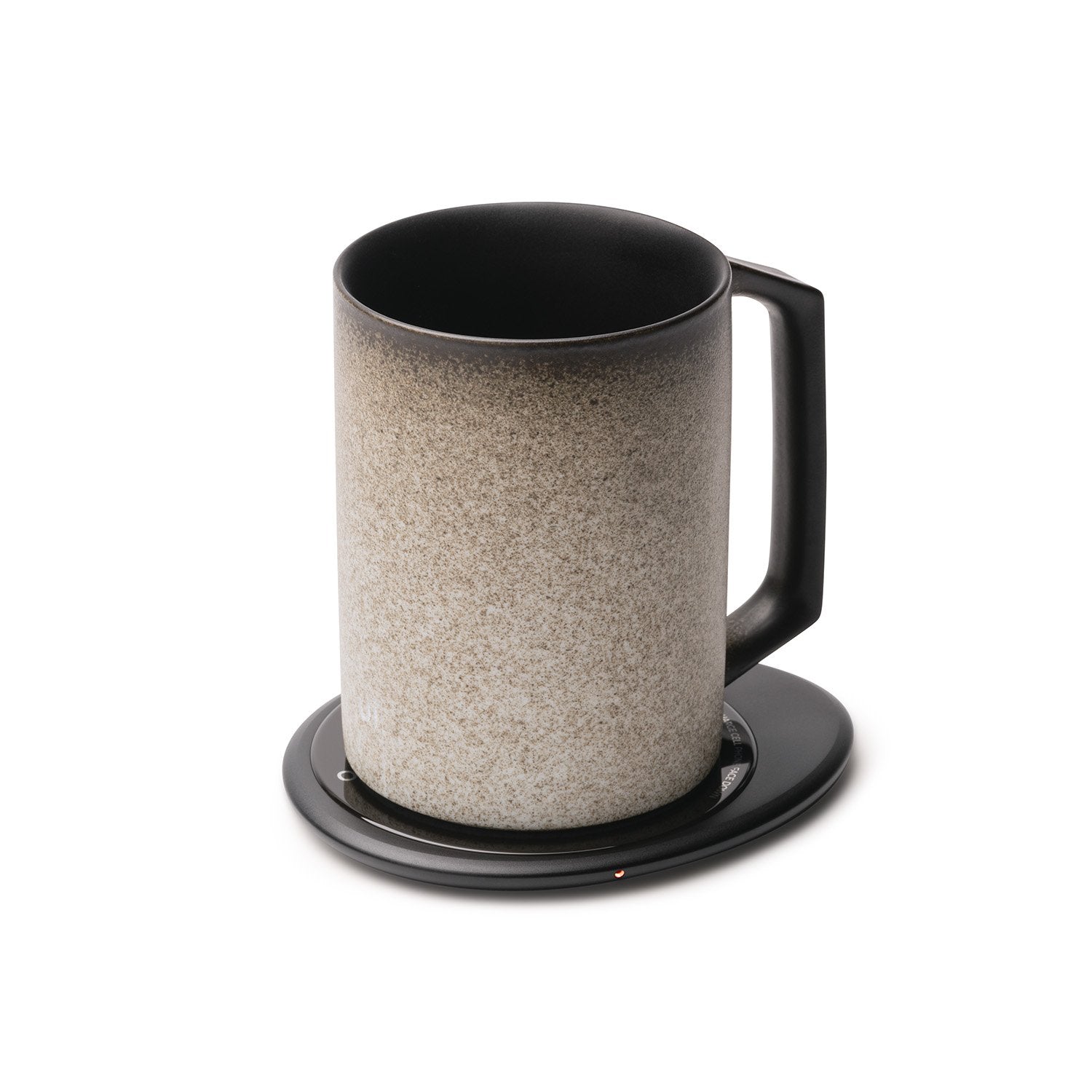 Stone textured mug on black pebble heating pad