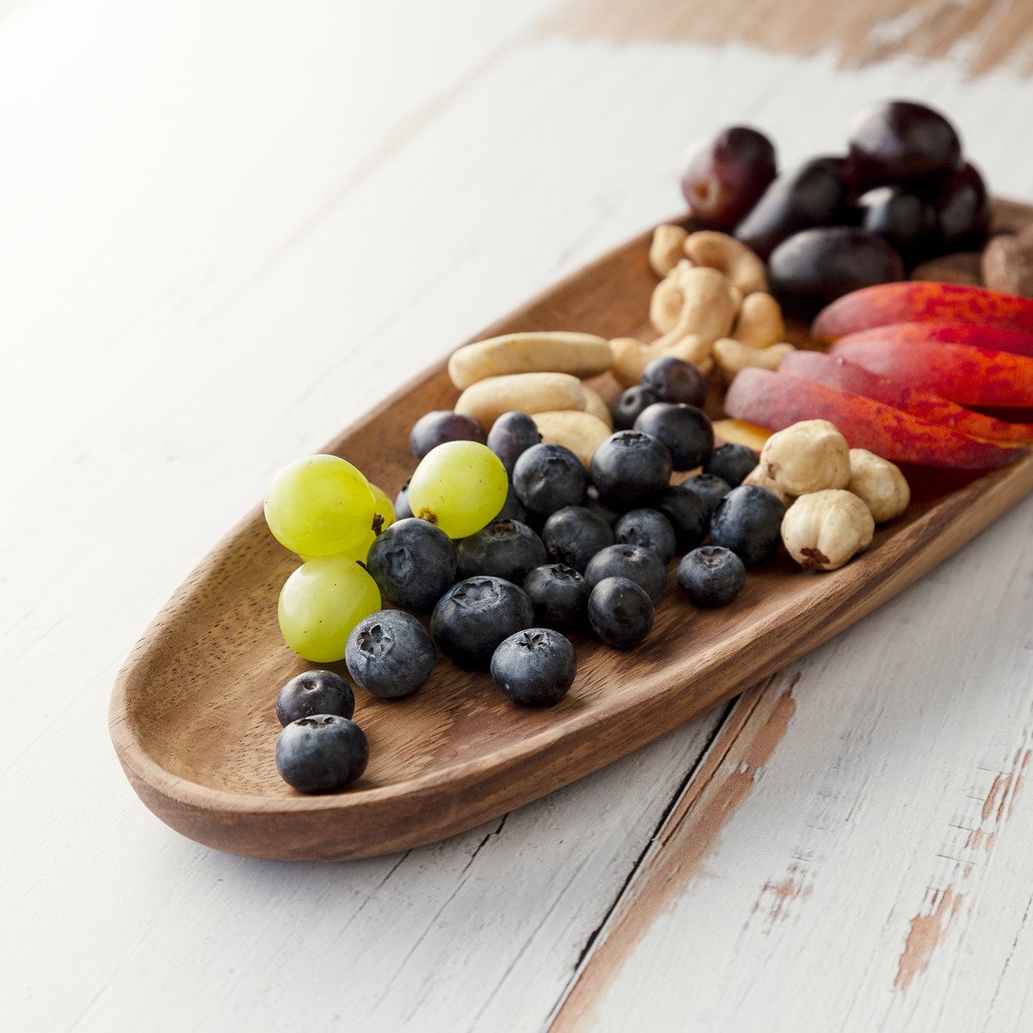 Fruit on large wooden plate