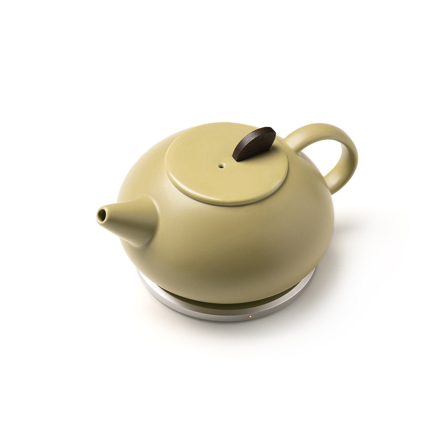Olive teapot on heating pad top